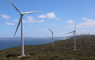 Wind turbine generating clean energy in a renewable energy farm