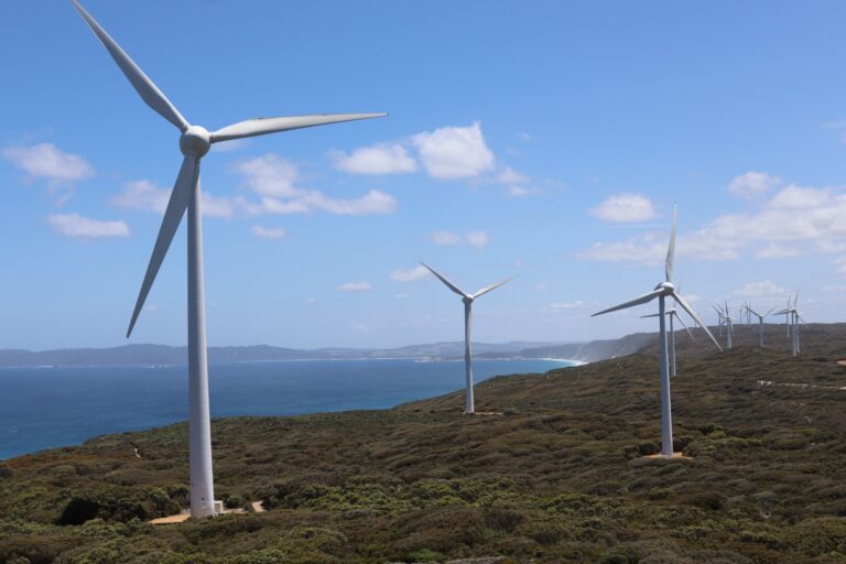 Wind turbine generating clean energy in a renewable energy farm